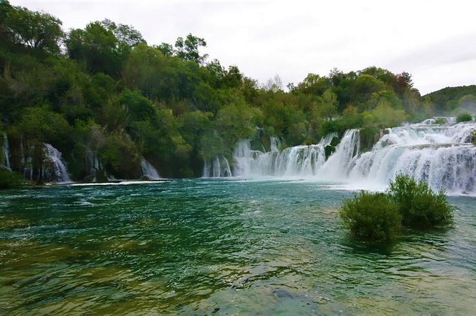 All inclusive luxury Krka waterfalls trip from Split or Trogir. - Visovac Monastery: island calm, peacocks, and medieval details