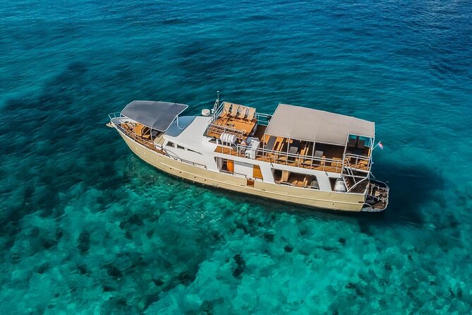 Blue Lagoon and 3 Island Boat Tour with Food and Drinks Included - Šolta’s Nečujam: the shipwreck swim stop most people remember