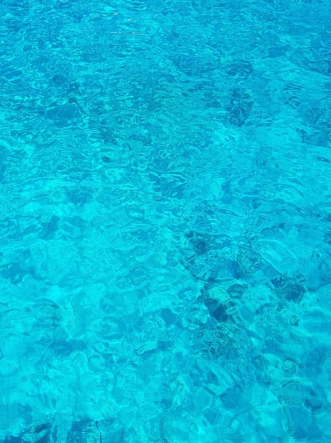 From Hvar: Blue cave group speedboat tour full day - Stiniva Cove: the “row your way in” cove swim