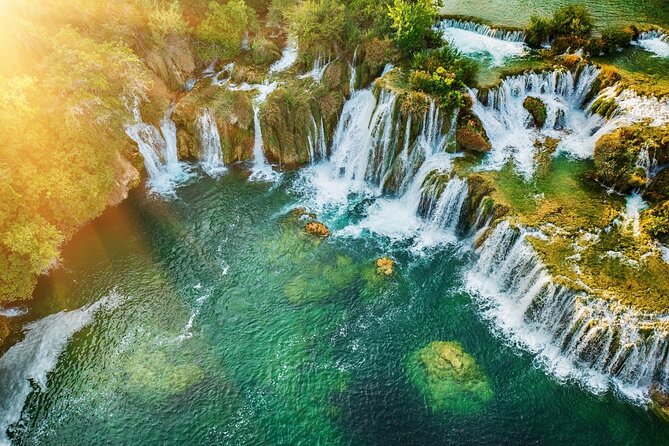From Split: Krka Waterfalls Trip with Boat Cruise and Swimming - Primosten Beach Time: Swimming and Eating at Your Tempo