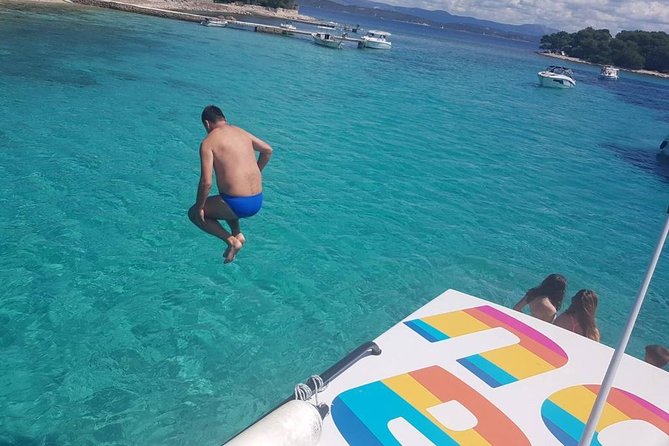 Private Luxury Boat tour for 12 from Split, Brac, Trogir, Hvar - Budikovac Island Swim: The Boat Jump Moment