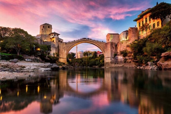 Private Tour Mostar and Kravice Waterfalls from Split - Mostar Old Bridge: 28 meters across the Neretva, with a tradition you might catch
