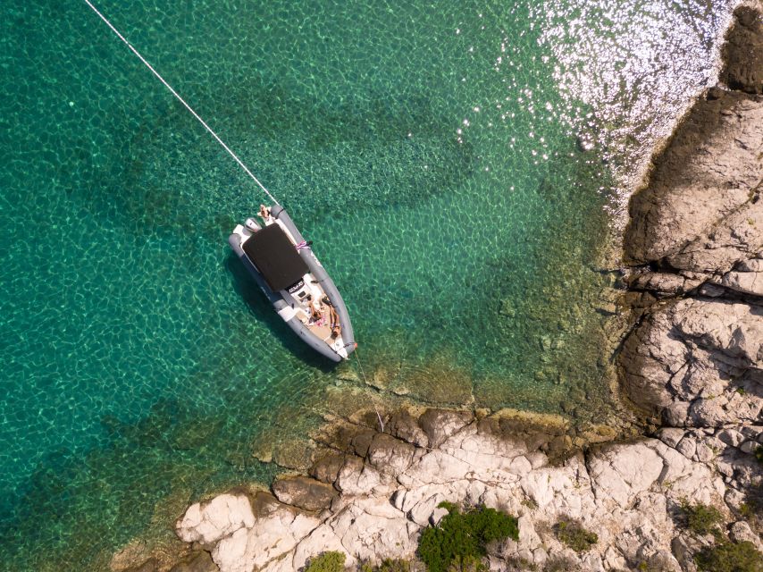 Split: Private Full Day Boat Trip to Blue Lagoon and Trogir - The sailing rhythm: music, downtime, sunset return, and dolphins