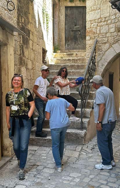 Trogir; Private walking tour of higlights of Trogir - The Riva promenade: sea views, palm trees, and anchored ships